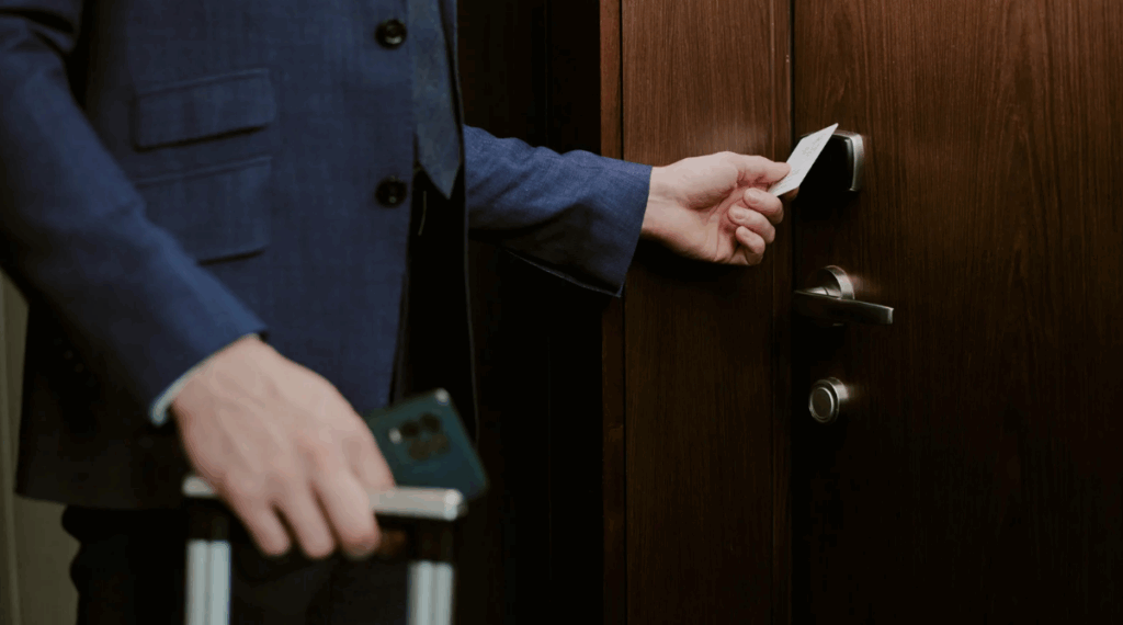 man opening his apartment with keycard